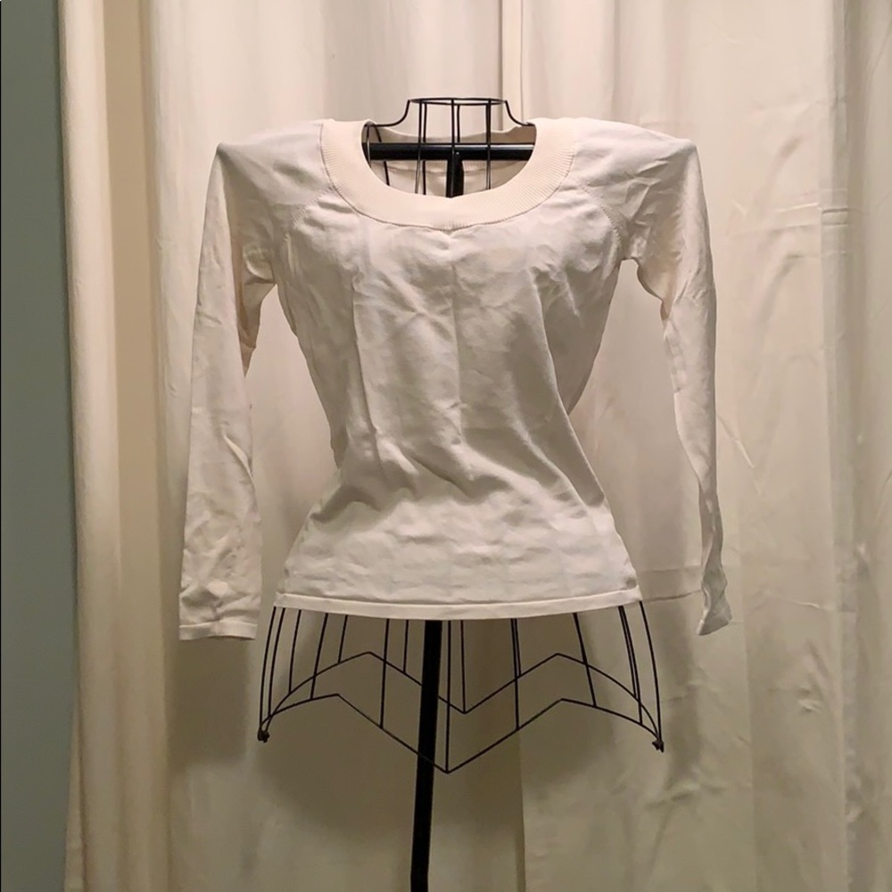 Cream rayon sweater.